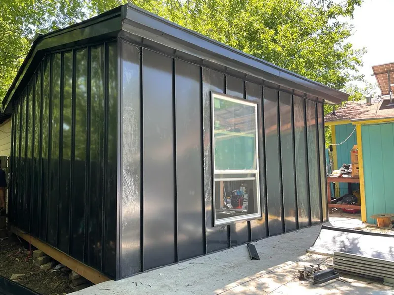 Black standing seam metal wall panels for Roof Inspection in Crowley